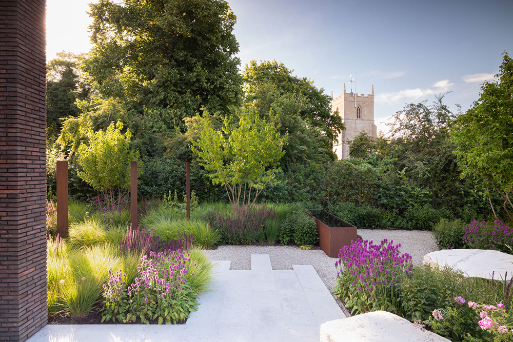 Colm Joseph garden design cambridgeshire naturalistic planting design church view sesleria autumnalis salvia stachys hummelo cornus mas limestone paving boulder seat corten steel water feature 